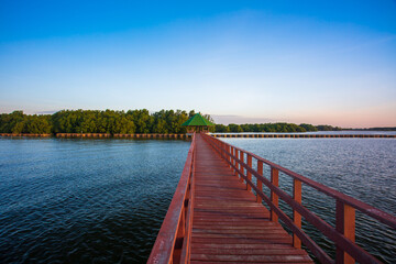 Obraz premium Beauty in nature red bridge long way and sunlight in morning landscape 