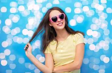 summer, valentine's day and people concept - smiling young woman or teenage girl in yellow t-shirt...