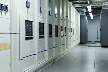 rows of closed servers in corridor of data center, cyber security concept