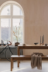 Creative composition of elegant dining room interior design with wooden family table, bench and rustic inspire home decorations. Modern home concept. Retro inspiration. Structure wallpaper. Template..