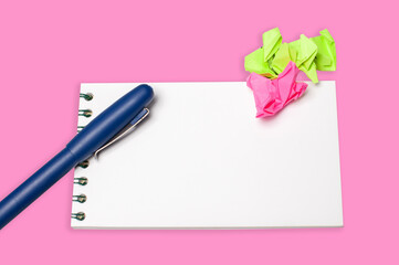 Notebook,pen and stciker isolated on pink background.Copy space