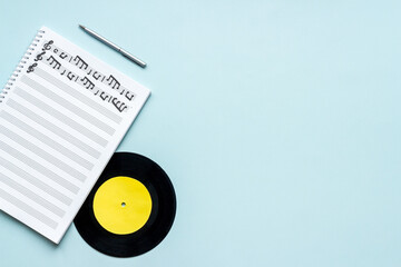 Music sheets with musical notes melody and vinyl record