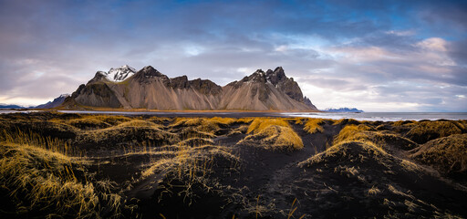 Panoramic landscape, unique view on hills with sand dunes. Location Stokksnes cape, Vestrahorn, Iceland, Europe. Scenic image of tourist attraction. Travel destination. Discover the beauty of earth