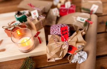 winter holidays and hobby concept - close up of christmas gifts for advent calendar at home