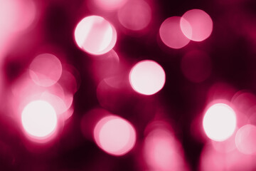 Blurred lights pink background. Abstract bokeh with soft light. Trendy color