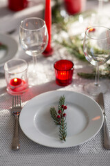 winter holidays, dinner party and celebration concept - close up of christmas table serving at home