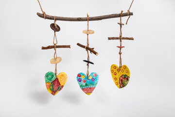 Hearts ceramic souvenirs for necklace. Handmade jewelry and amulets. Hand painted and decorated. Natural materials