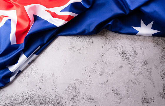 Happy Australia day concept. Australian flag against stone background. 26 January.
