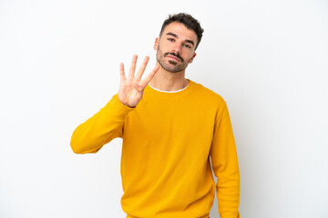 Fototapeta premium Young caucasian man isolated on white background happy and counting four with fingers