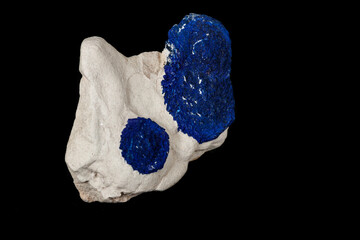 Macro mineral stone Azurite in siltstone against black background