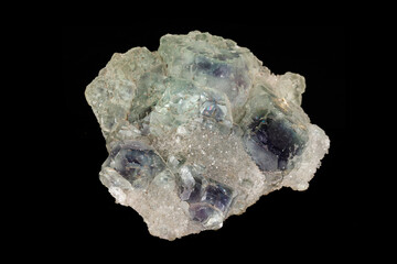 macro mineral fluorite stone on black background