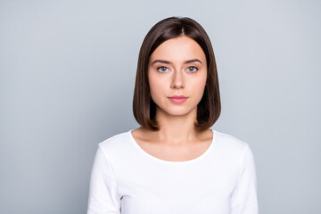 Fototapeta premium Photo of strict brunette young lady wear white shirt isolated on grey color background