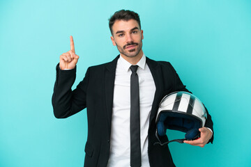 Business caucasian man with motorbike helmet isolated on blue background pointing up a great idea