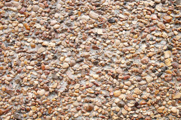 Abstract nature background. Sand texture background. Natural small brown stones. Seashore, beach. Sea pebbles.