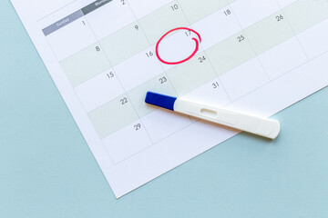 Pregnancy test on calendar. Time to check pregnancy day