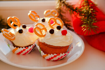 Deer shaped cupcake on a white background. Decor for Christmas