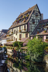 Fototapeta premium Traditional Alsatian half-timbered houses along the Lauch River in Little Venice tourist district of Colmar, France