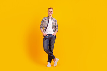 Fototapeta na wymiar Full length photo of young handsome man modern outfit agent economist isolated over yellow color background