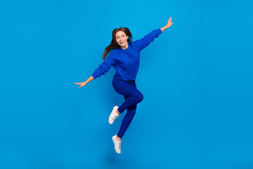 Full length body size view of attractive cheerful carefree girl jumping flying having fun isolated...