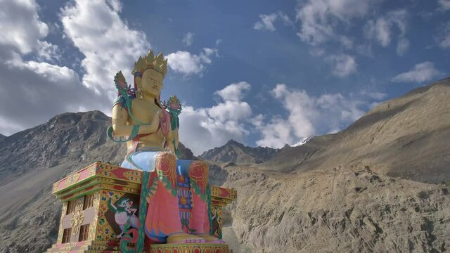 Time lapse of Clouds passing over the giant and elegant statue of Maitreya Buddha situated in Nubra Valley, Ladakh in Karakoram (Northern Himalayas) mountain ranges. 
