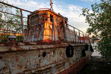 old rusty boat - Powered by Adobe