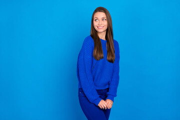 Fototapeta premium Portrait of attractive curious cheerful girl posing deciding copy empty space isolated on bright blue color background