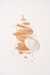 Beauty, skincare products setting. Beige cosmetic cream smear isolated on white background. White beauty foam, powder