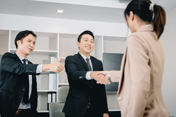 Business office staff employee promote congratulate hand shake with boss team leader.