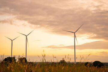 Obraz premium Wind turbines of global ecology with cloud background on the sky. alternative electricity source to be sustainable resources in the future. Clean energy concept saves the world