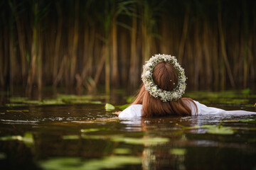 woman in the water with flower crown
