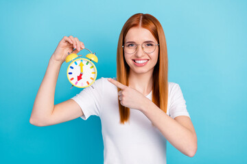 Photo of young girl happy positive smile point finger watch clock choice deadline select isolated...