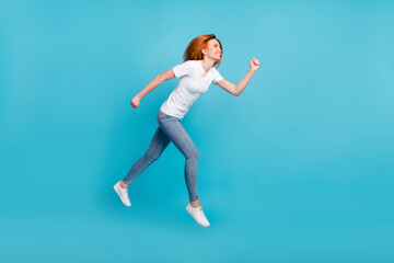 Full body profile side photo of young girl happy positive smile go walk run hurry sale jump isolated over blue color background
