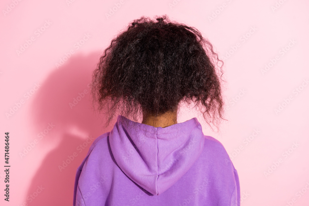 Poster Photo of curly wavy afro girl wear violet sweatshirt standing back isolated pink color background