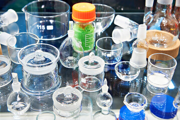 Laboratory glass bottles and flasks in store