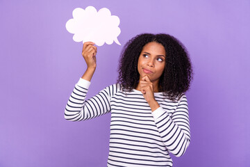 Photo of thoughtful minded, young lady hold speech bubble brainstorming isolated on violet color...