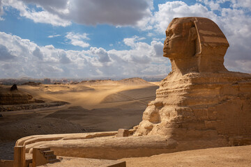 Sphinx close-up and pyramids at Giza, Cairo