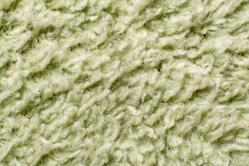 Light green napkin pile structure close-up.