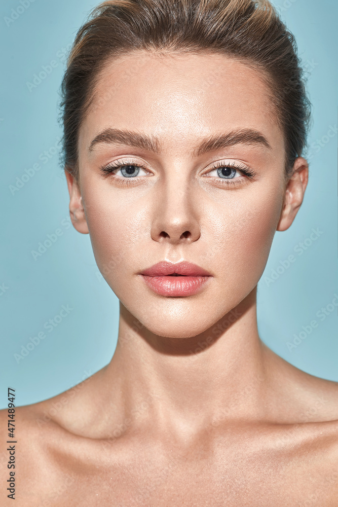 Wall mural beauty portrait of caucasian young woman with healthy moisturized facial skin and natural plump lips