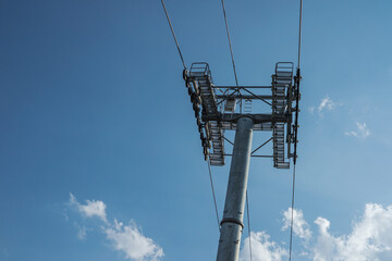Cable car support wire rope on blue sky background.