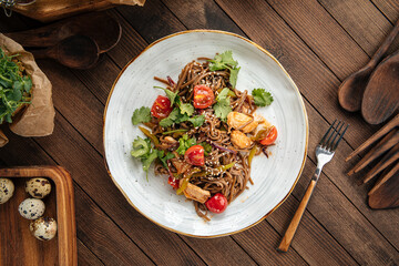 Plate of buckwheat soba noodles with chicken wok