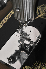 Antique sewing machine. Old sewing machine details. Vintage tailor sewing machine.