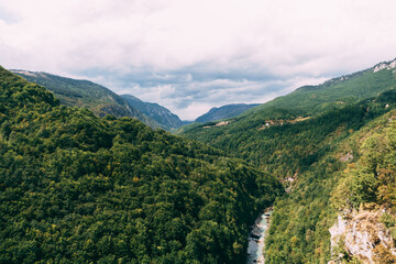 Fototapeta na wymiar Tara River flows along the bottom of a canyon in the mountains. Montenegro