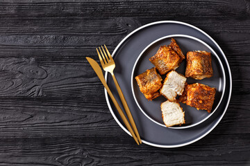 fried pieces of hake on a plate