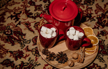 red teapot and cups in Christmas style