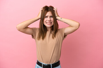 Young English woman isolated on pink background doing nervous gesture