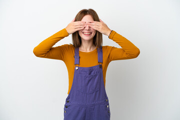 Young English woman isolated on white background covering eyes by hands and smiling