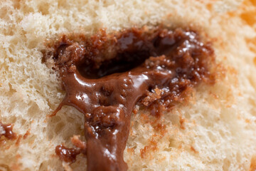 donut with chocolate filling macro shot of fill