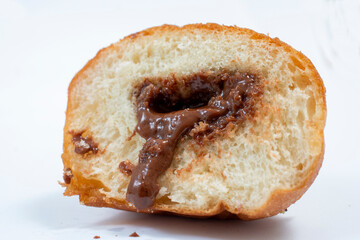 small round donuts with chocolate filling on white background