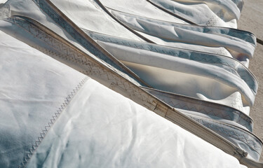 Folded sails in a roll , sail maintenance and storage for winter