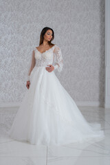 Fototapeta premium Girl with wedding dress posing for photo shoot